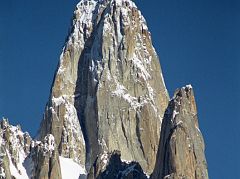 13 Uli Biaho Tower Close Up From Khoburtse Just After Sunrise Uli Biaho Tower shines in the early morning sun from Khoburtse. The first ascent of Uli Biaho Tower (6109m) was made on July 3, 1979 by John Roskelley, Kim Schimtz, Ron Kauk and Bill Forrest via the east face. One by one, each of us climbed to its broad top, soaked in the evenings warmth, cried a little, laughed a little, and, for just a few brief moments, forgot the cold, thirst, and danger below. - Stories Off The Wall by John Roskelley.